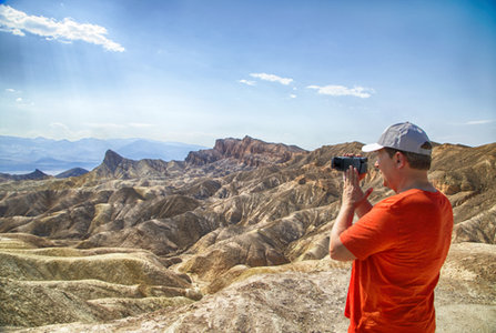 Man Filming in Desert 
