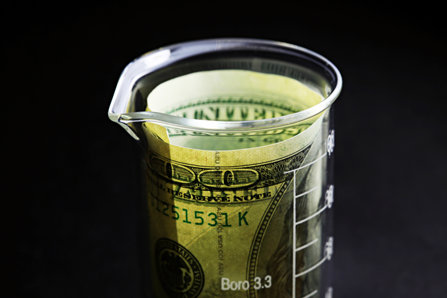 Money inside measuring cup