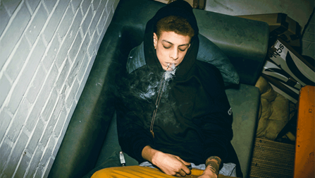 Young man smoking pot